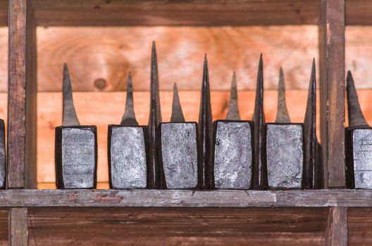 Old rusty tools, hammer on old wooden table.