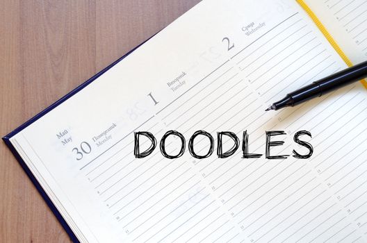 Doodles text concept write on notebook