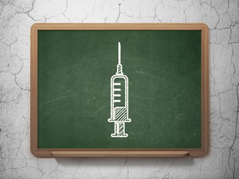 Healthcare concept: Syringe icon on Green chalkboard on grunge wall background