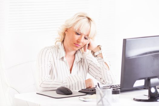 Beautiful mature Business woman having problems at work