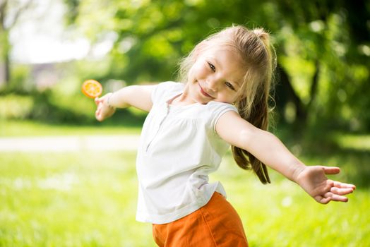 Cute Little Girl having fun in The Park.