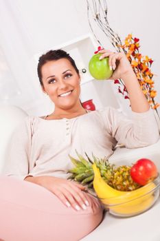 Beautiful young woman with fruits