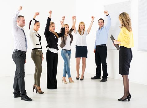 Successful business team congratulates colleague on the exposure.