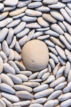 Small pebbles around big stone