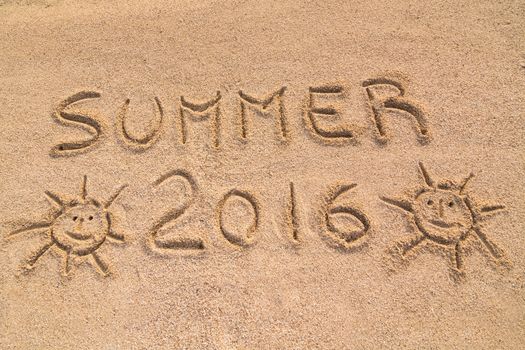 In the picture the words on the sand "Summer 2016".