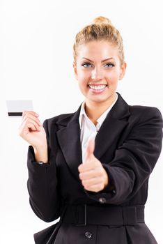 Businesswoman showing thumbs up and holding a credit card.