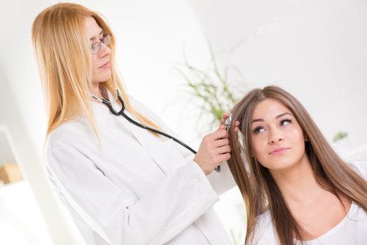 Cute young girl have Medical examination of Damaged Hair.