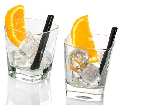 empty glasses of spritz aperitif aperol cocktail with orange slices and ice cubes isolated on white background