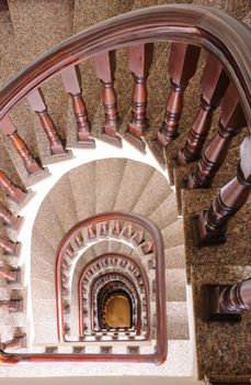 Vintage spiral staircase Interior in old house.