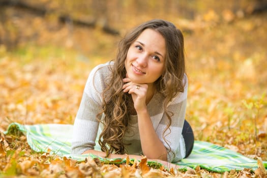 Twenty-five young beautiful girl walks by Europeans autumn forest