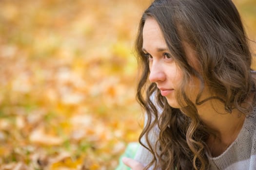 Twenty-five young beautiful girl walks by Europeans autumn forest