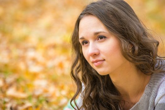 Twenty-five young beautiful girl walks by Europeans autumn forest