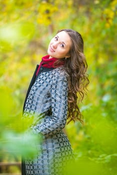 Twenty-five young beautiful girl walks by Europeans autumn forest