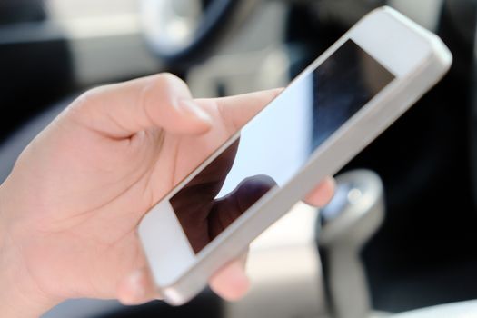 Woman Sitting in the Car and Using Smart Phone