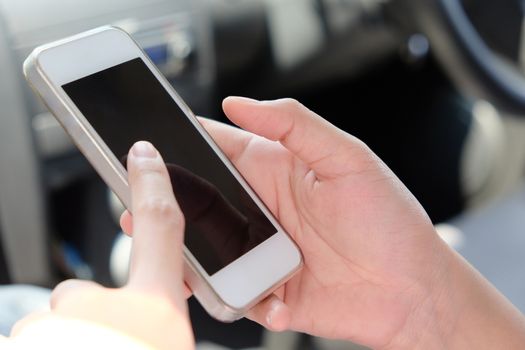 Woman Sitting in the Car and Using Smart Phone