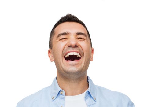 happiness, emotions and people concept - laughing man