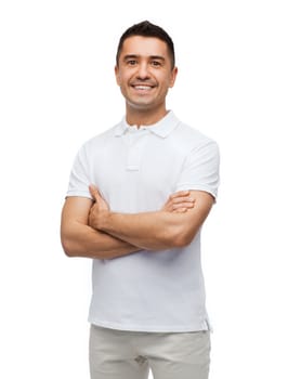 happiness and people concept - smiling man in white t-shirt with crossed arms