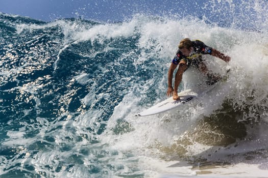 SNAPPER ROCKS, GOLD COAST, AUSTRALIA - 9 MARCH: Unidentified Surfer races the Quiksilver & Roxy Pro World Title Event. 9 March 2013, Snapper Rocks, Gold Coast, Australia