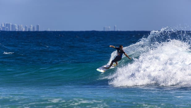 SNAPPER ROCKS, GOLD COAST, AUSTRALIA - 9 MARCH: Unidentified Surfer races the Quiksilver & Roxy Pro World Title Event. 9 March 2013, Snapper Rocks, Gold Coast, Australia