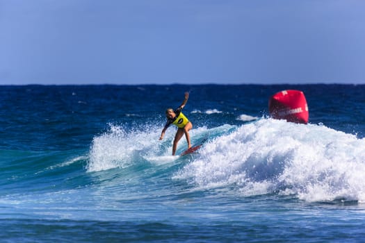 SNAPPER ROCKS, GOLD COAST, AUSTRALIA - 9 MARCH: Unidentified Surfer races the Quiksilver & Roxy Pro World Title Event. 9 March 2013, Snapper Rocks, Gold Coast, Australia