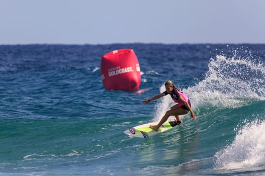 SNAPPER ROCKS, GOLD COAST, AUSTRALIA - 9 MARCH: Unidentified Surfer races the Quiksilver & Roxy Pro World Title Event. 9 March 2013, Snapper Rocks, Gold Coast, Australia