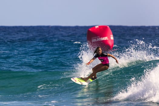 SNAPPER ROCKS, GOLD COAST, AUSTRALIA - 9 MARCH: Unidentified Surfer races the Quiksilver & Roxy Pro World Title Event. 9 March 2013, Snapper Rocks, Gold Coast, Australia