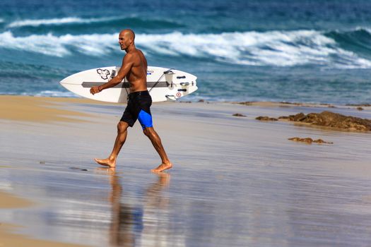 SNAPPER ROCKS, GOLD COAST, AUSTRALIA - 9 MARCH: Unidentified Surfer races the Quiksilver & Roxy Pro World Title Event. 9 March 2013, Snapper Rocks, Gold Coast, Australia