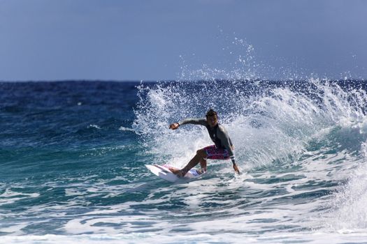 SNAPPER ROCKS, GOLD COAST, AUSTRALIA - 9 MARCH: Unidentified Surfer races the Quiksilver & Roxy Pro World Title Event. 9 March 2013, Snapper Rocks, Gold Coast, Australia