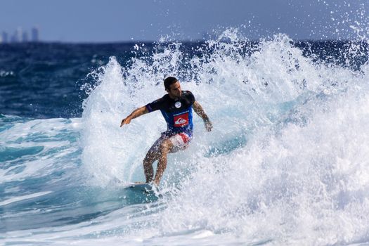 SNAPPER ROCKS, GOLD COAST, AUSTRALIA - 9 MARCH: Unidentified Surfer races the Quiksilver & Roxy Pro World Title Event. 9 March 2013, Snapper Rocks, Gold Coast, Australia