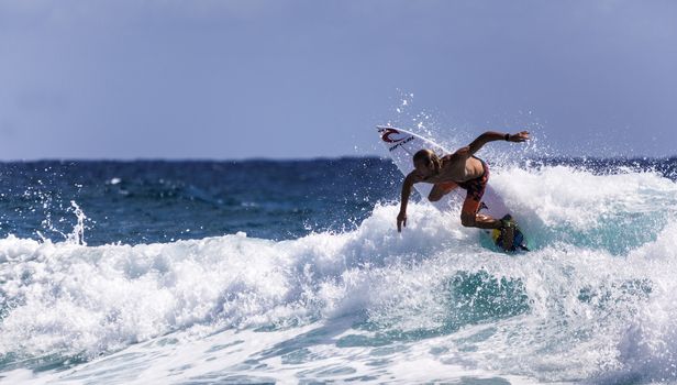 SNAPPER ROCKS, GOLD COAST, AUSTRALIA - 9 MARCH: Unidentified Surfer races the Quiksilver & Roxy Pro World Title Event. 9 March 2013, Snapper Rocks, Gold Coast, Australia