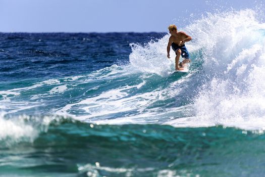 SNAPPER ROCKS, GOLD COAST, AUSTRALIA - 9 MARCH: Unidentified Surfer races the Quiksilver & Roxy Pro World Title Event. 9 March 2013, Snapper Rocks, Gold Coast, Australia