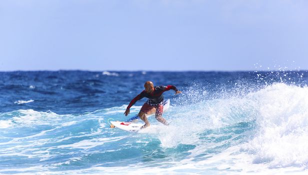 SNAPPER ROCKS, GOLD COAST, AUSTRALIA - 9 MARCH: Unidentified Surfer races the Quiksilver & Roxy Pro World Title Event. 9 March 2013, Snapper Rocks, Gold Coast, Australia