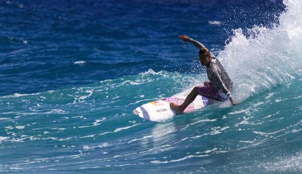 SNAPPER ROCKS, GOLD COAST, AUSTRALIA - 9 MARCH: Unidentified Surfer races the Quiksilver & Roxy Pro World Title Event. 9 March 2013, Snapper Rocks, Gold Coast, Australia