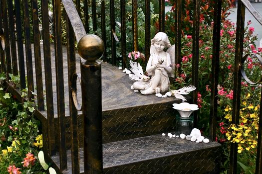 Angel with flowers and plants