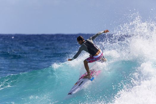 SNAPPER ROCKS, GOLD COAST, AUSTRALIA - 9 MARCH: Unidentified Surfer races the Quiksilver & Roxy Pro World Title Event. 9 March 2013, Snapper Rocks, Gold Coast, Australia