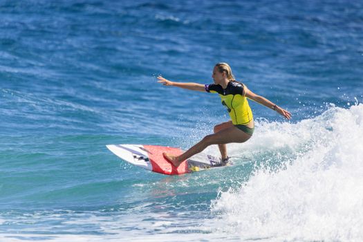 SNAPPER ROCKS, GOLD COAST, AUSTRALIA - 9 MARCH: Unidentified Surfer races the Quiksilver & Roxy Pro World Title Event. 9 March 2013, Snapper Rocks, Gold Coast, Australia