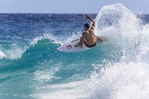 SNAPPER ROCKS, GOLD COAST, AUSTRALIA - 9 MARCH: Unidentified Surfer races the Quiksilver & Roxy Pro World Title Event. 9 March 2013, Snapper Rocks, Gold Coast, Australia