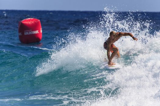 SNAPPER ROCKS, GOLD COAST, AUSTRALIA - 9 MARCH: Unidentified Surfer races the Quiksilver & Roxy Pro World Title Event. 9 March 2013, Snapper Rocks, Gold Coast, Australia