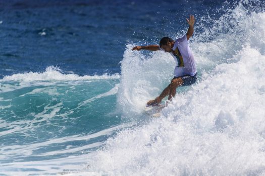 SNAPPER ROCKS, GOLD COAST, AUSTRALIA - 9 MARCH: Unidentified Surfer races the Quiksilver & Roxy Pro World Title Event. 9 March 2013, Snapper Rocks, Gold Coast, Australia