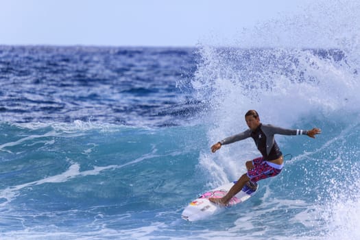 SNAPPER ROCKS, GOLD COAST, AUSTRALIA - 9 MARCH: Unidentified Surfer races the Quiksilver & Roxy Pro World Title Event. 9 March 2013, Snapper Rocks, Gold Coast, Australia