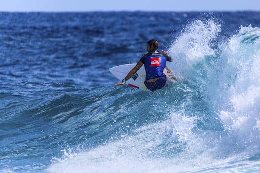 SNAPPER ROCKS, GOLD COAST, AUSTRALIA - 9 MARCH: Unidentified Surfer races the Quiksilver & Roxy Pro World Title Event. 9 March 2013, Snapper Rocks, Gold Coast, Australia