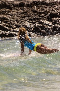 SNAPPER ROCKS, GOLD COAST, AUSTRALIA - 9 MARCH: Unidentified Surfer races the Quiksilver & Roxy Pro World Title Event. 9 March 2013, Snapper Rocks, Gold Coast, Australia