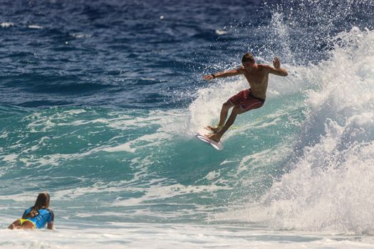 SNAPPER ROCKS, GOLD COAST, AUSTRALIA - 9 MARCH: Unidentified Surfer races the Quiksilver & Roxy Pro World Title Event. 9 March 2013, Snapper Rocks, Gold Coast, Australia