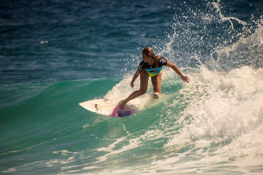 SNAPPER ROCKS, GOLD COAST, AUSTRALIA - 9 MARCH: Unidentified Surfer races the Quiksilver & Roxy Pro World Title Event. 9 March 2013, Snapper Rocks, Gold Coast, Australia