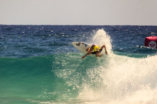 SNAPPER ROCKS, GOLD COAST, AUSTRALIA - 9 MARCH: Unidentified Surfer races the Quiksilver & Roxy Pro World Title Event. 9 March 2013, Snapper Rocks, Gold Coast, Australia