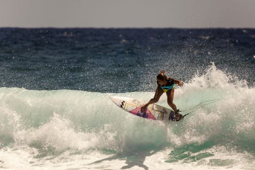 SNAPPER ROCKS, GOLD COAST, AUSTRALIA - 9 MARCH: Unidentified Surfer races the Quiksilver & Roxy Pro World Title Event. 9 March 2013, Snapper Rocks, Gold Coast, Australia