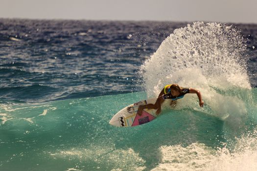 SNAPPER ROCKS, GOLD COAST, AUSTRALIA - 9 MARCH: Unidentified Surfer races the Quiksilver & Roxy Pro World Title Event. 9 March 2013, Snapper Rocks, Gold Coast, Australia