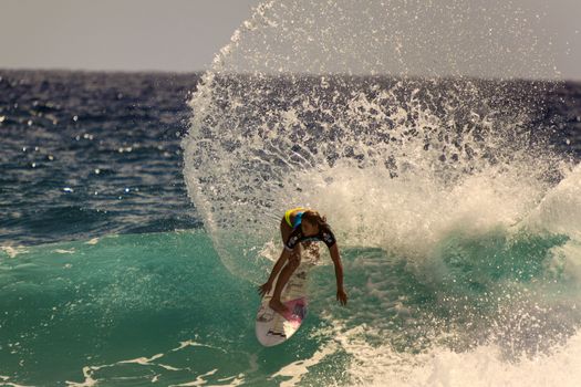 SNAPPER ROCKS, GOLD COAST, AUSTRALIA - 9 MARCH: Unidentified Surfer races the Quiksilver & Roxy Pro World Title Event. 9 March 2013, Snapper Rocks, Gold Coast, Australia