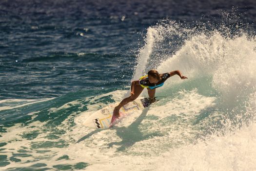 SNAPPER ROCKS, GOLD COAST, AUSTRALIA - 9 MARCH: Unidentified Surfer races the Quiksilver & Roxy Pro World Title Event. 9 March 2013, Snapper Rocks, Gold Coast, Australia