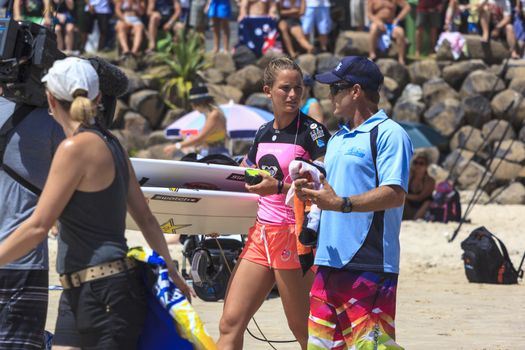 SNAPPER ROCKS, GOLD COAST, AUSTRALIA - 9 MARCH: Unidentified Surfer races the Quiksilver & Roxy Pro World Title Event. 9 March 2013, Snapper Rocks, Gold Coast, Australia